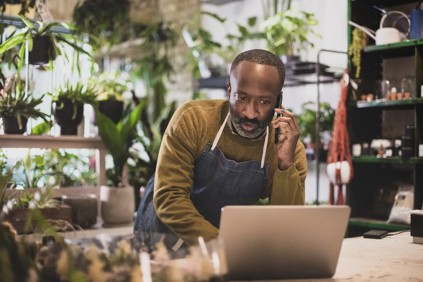 Business owner on phone with advisor